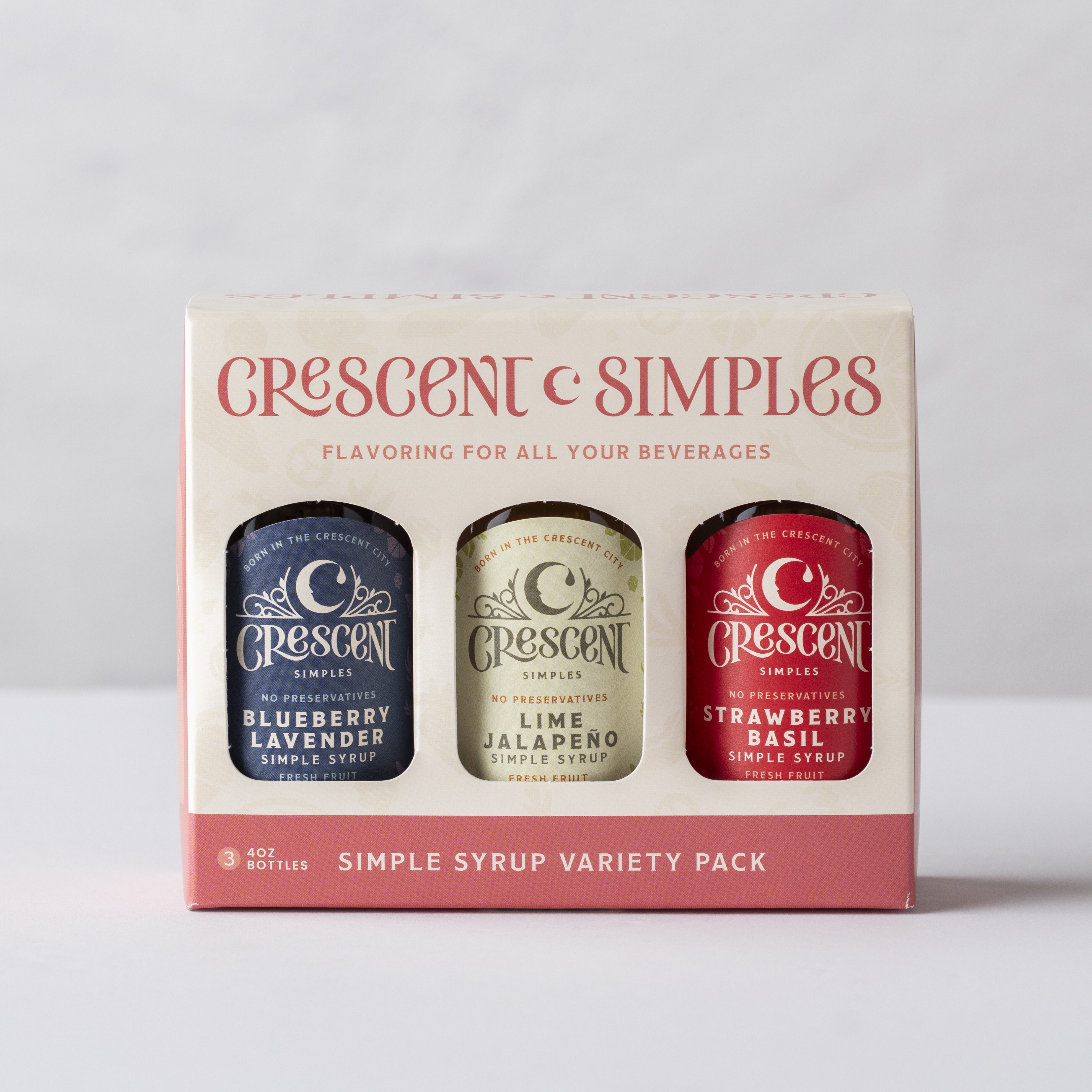 A branded 3-pack of Crescent Simples syrups.